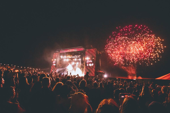A music festival brought to life with accompanying fireworks.